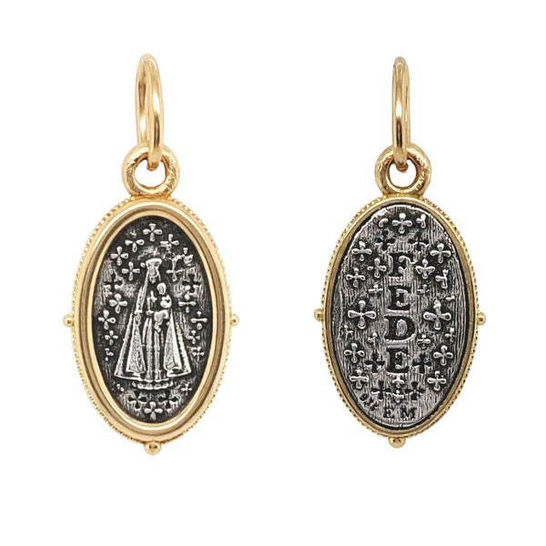 small oval Mary Magdalene double sided charm reads "faith" shown in oxidized sterling silver with 18k gold rim & bail #c358c