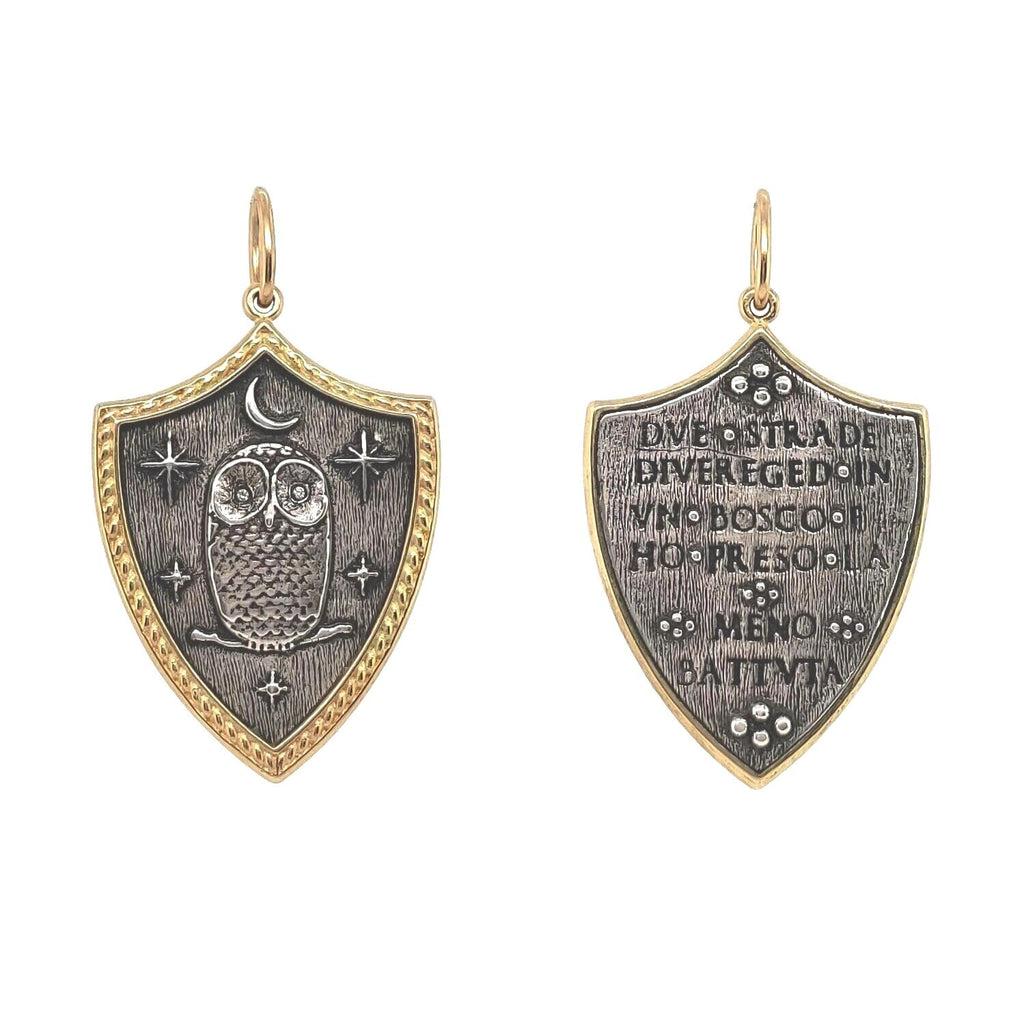 large shield with owl, moon & stars with white diamond .004cts eyes  reads "Two roads diverged in a wood & I took the one less traveled" by Robert Frost shown in oxidized sterling silver with 18k gold rim & bail #c195d