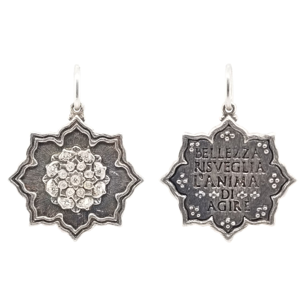 small multi layer lotus double sided charm with white diamonds .14cts on flower side reads "Beauty awakens the soul to act" by Dante Alighieri shown in oxidized sterling silver  #c214-2