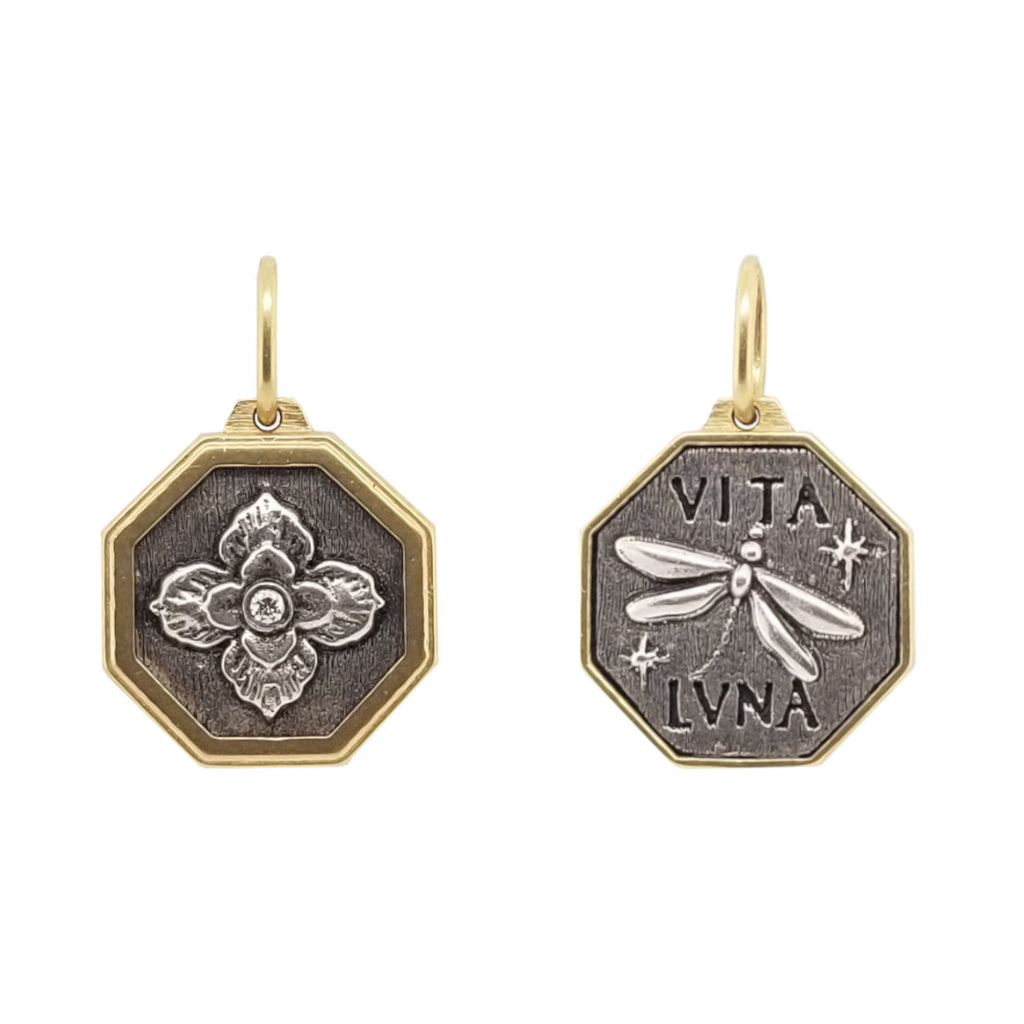 small Latin hexagon with ornate clover + dragonfly with white diamond .02cts (1) center of flower reads "crazy life" shown in oxidized sterling silver with 18k gold rim & bail #c218d