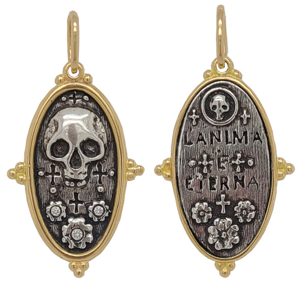 skull + flowers double sided charm with white diamonds .015cts on flowers reads "the soul is eternal" shown in oxidized sterling silver with 18k gold rim & bail #c263d