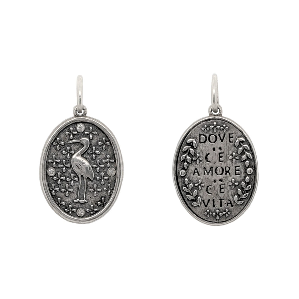 Ibis double sided charm with diamond .032cts dots on Ibis side reads "Where there is love there is life" by Mahatma Gandhi. Shown in oxidized sterling silver #c268-2