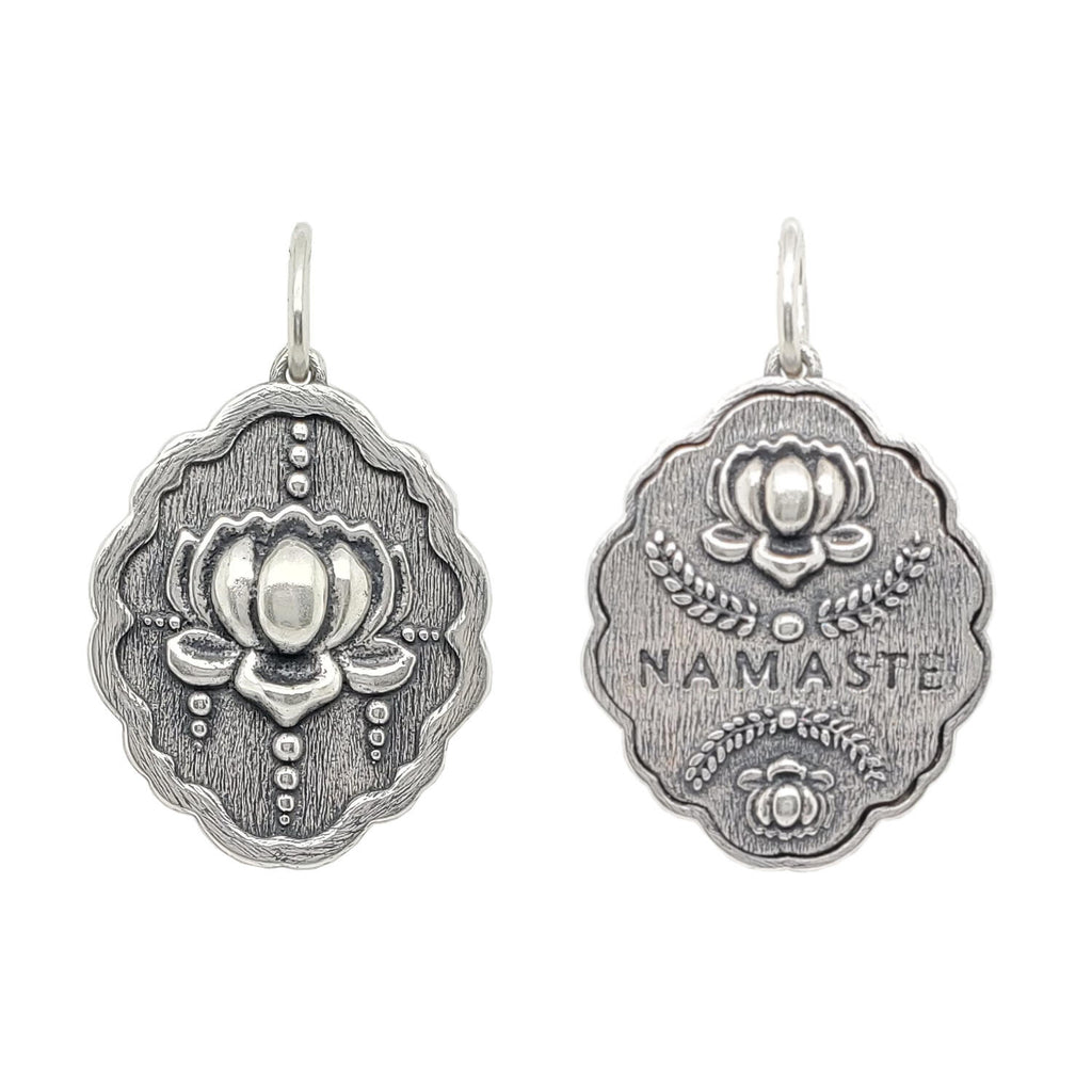 lotus double sided charm reads  "namaste" sided charm shown in oxidized sterling silver #c293-0 