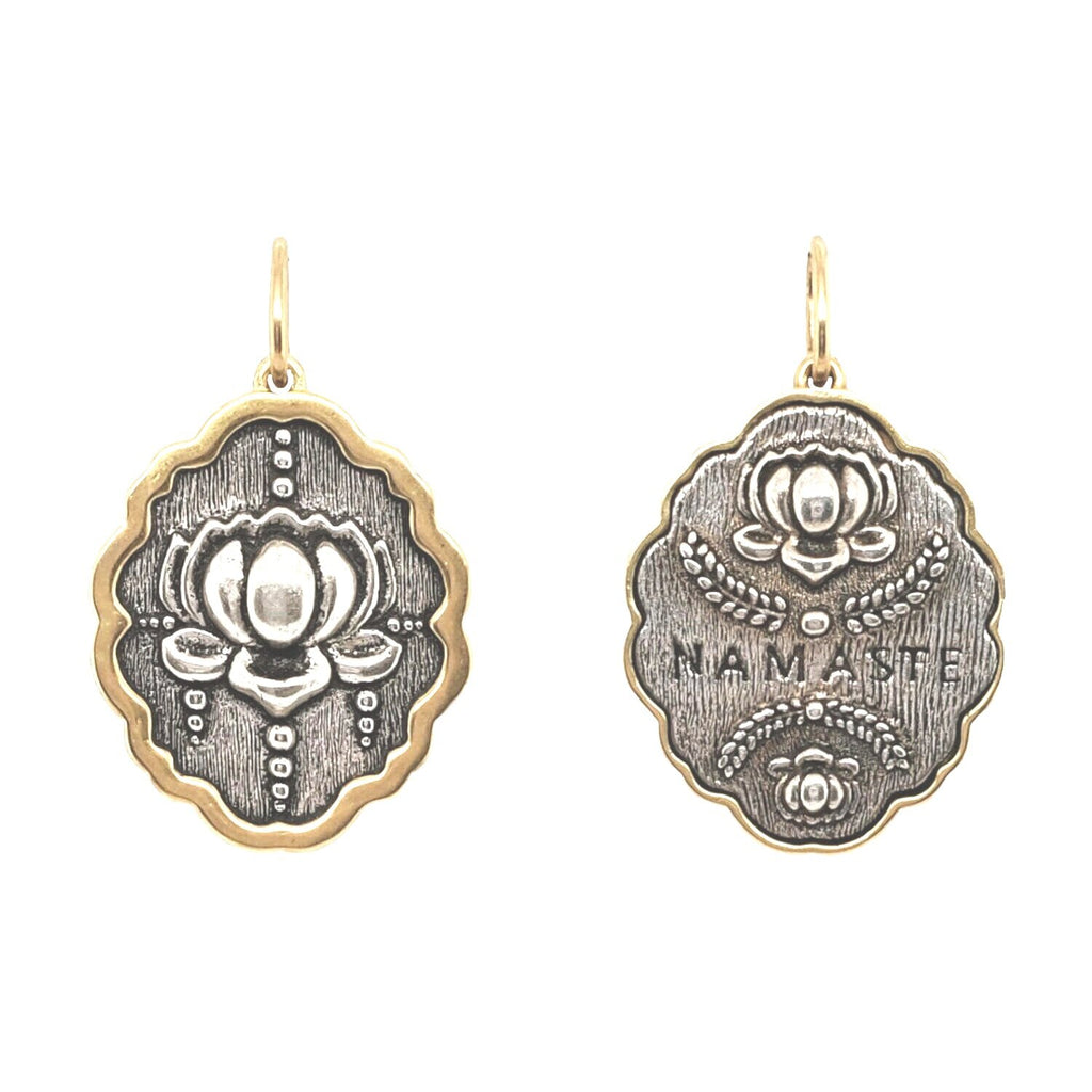 lotus double sided charm reads "namaste" sided charm shown in oxidized sterling silver with 18k gold rim & bail #c293c