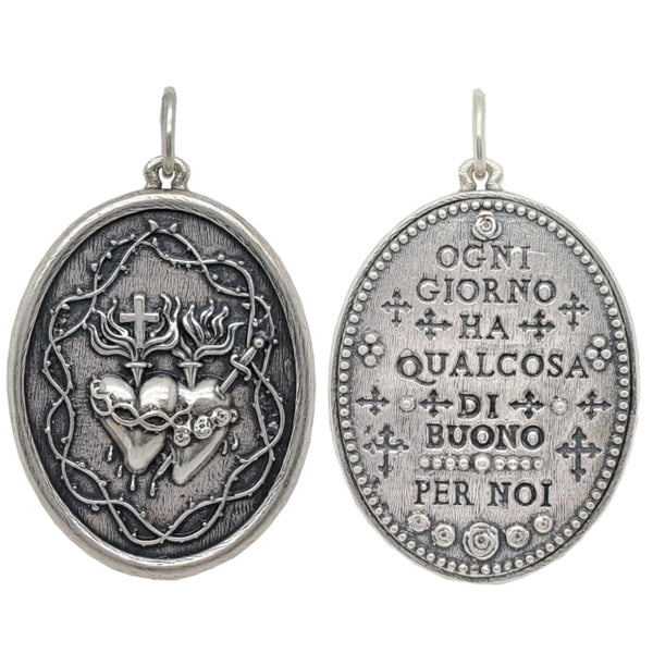 double sided sacred heart charm reads "Each day provided it's own gifts" by Marcus Aurelius shown in oxidized sterling silver #c310-0