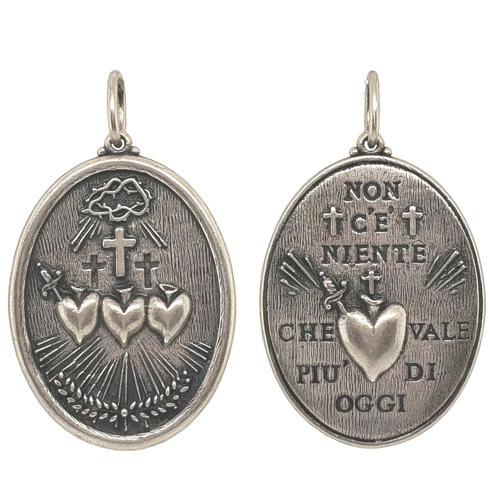 triple sacred heart double sided charm reads "Nothing is worth more than this day" by  Johann Wolfgang von Goethe. Shown in oxidized sterling silver  #c311-0