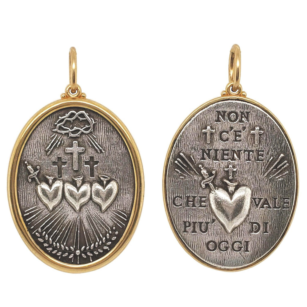 triple sacred heart double sided charm reads "Nothing is worth more than this day" by Johann Wolfgang von Goethe. Shown in oxidized sterling silver  with 18k gold rim & bail #c311c