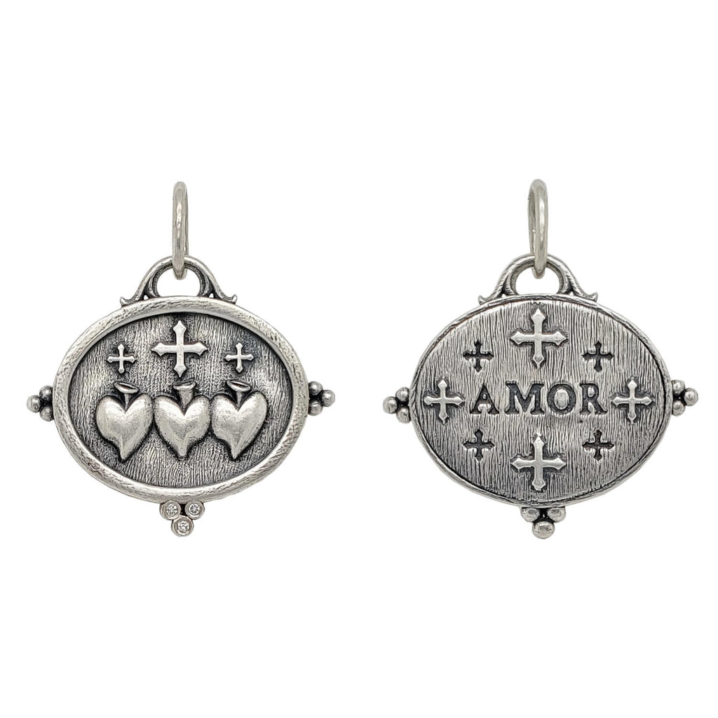 triple sacred heart + crosses double sided charm with white diamonds .015cts on heart side reads "love". Shown in oxidized sterling silver #c314-2