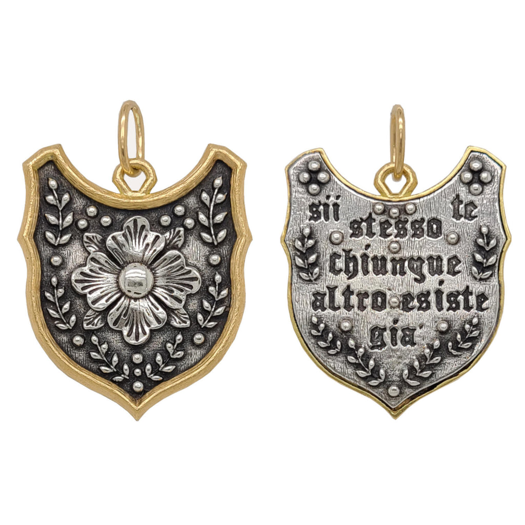 large funky shiled + flower double side charm reads "be yourself everyone else is taken" by Oscar Wilde. Shown in oxidized sterling silver with 18k gold rim & bail #c329c