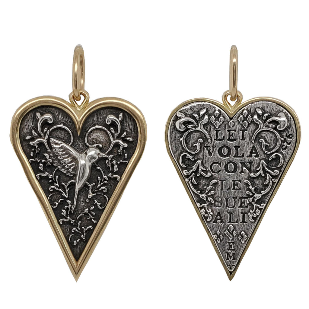 small slim heart + floral hummingbird double sided charm reads "she flies with her own wings" shown in oxidized sterling silver with 18k gold rim & bail #c343c