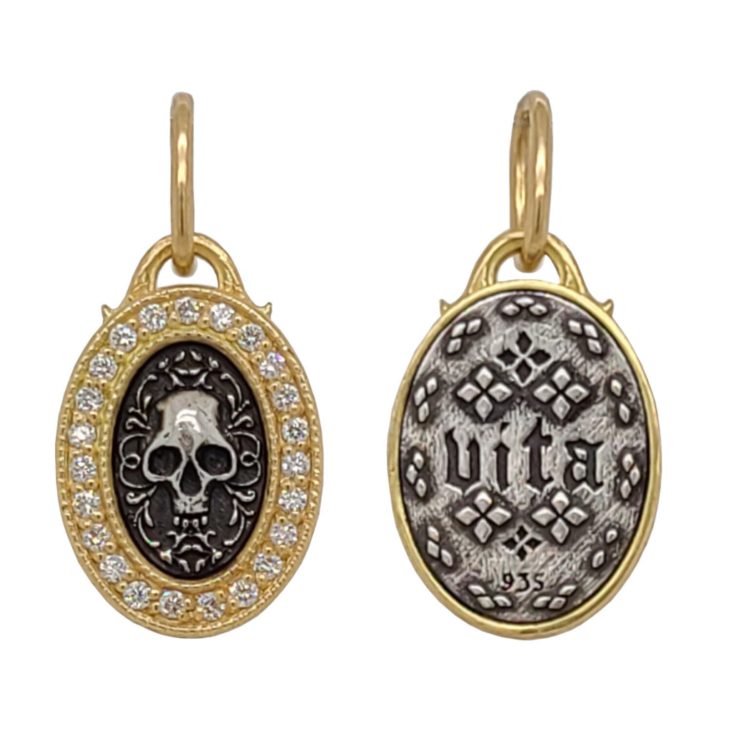 baby oval double sided skull charm with white diamond .19cts frame reads "life" shown in oxidized sterling silver with 18k gold frame & bail #c336d-d