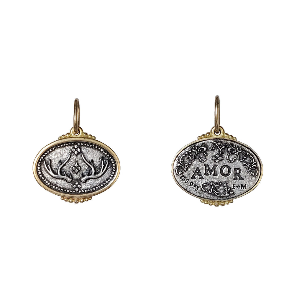 small antlers double sided charm reads "love" shown in oxidized sterling silver with 18k gold rim & bail #c421c
