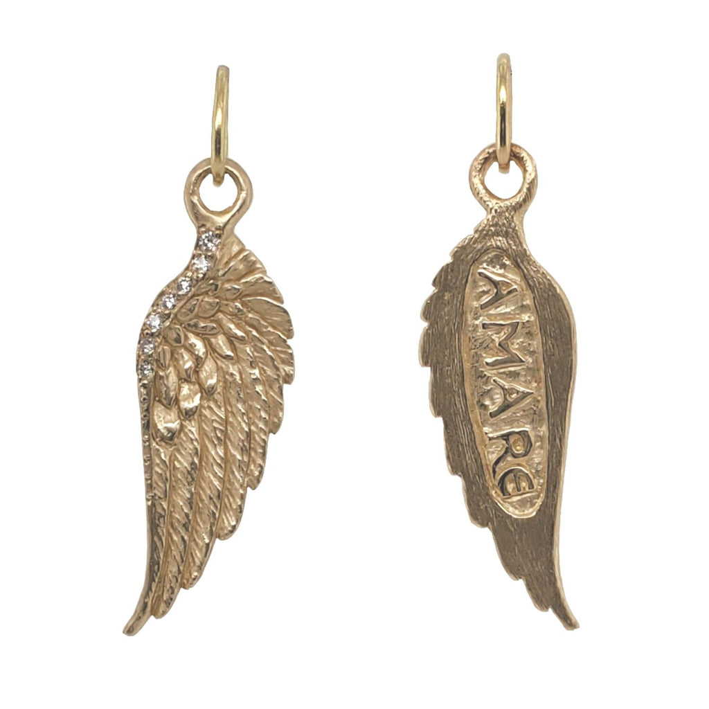 large feathered double sided wing shown  in 14k gold reads "love" with white diamonds .0425cts on wings edge #co64-3