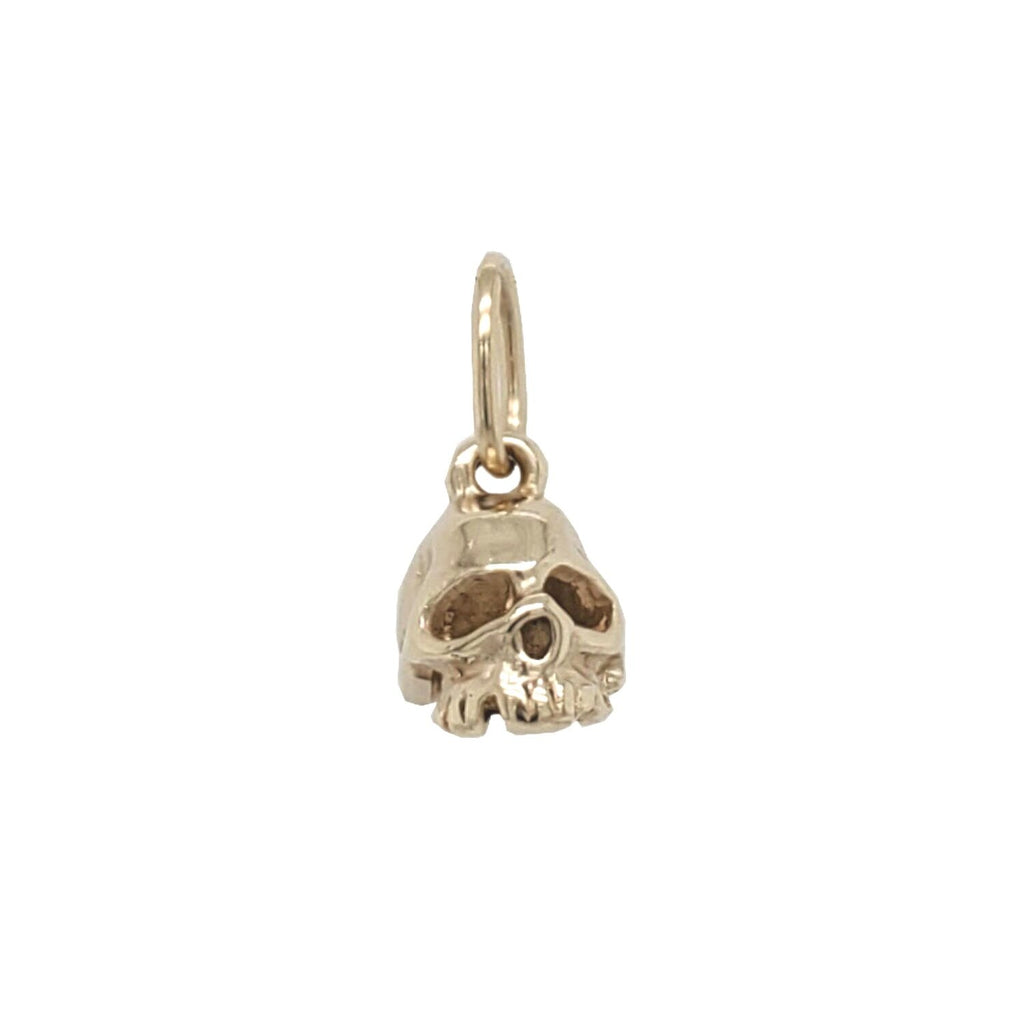 medium skull charm shown in 14k gold #sk1-1